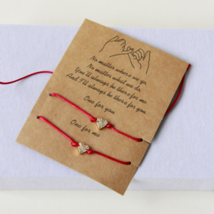 red string thread bracelet with heart