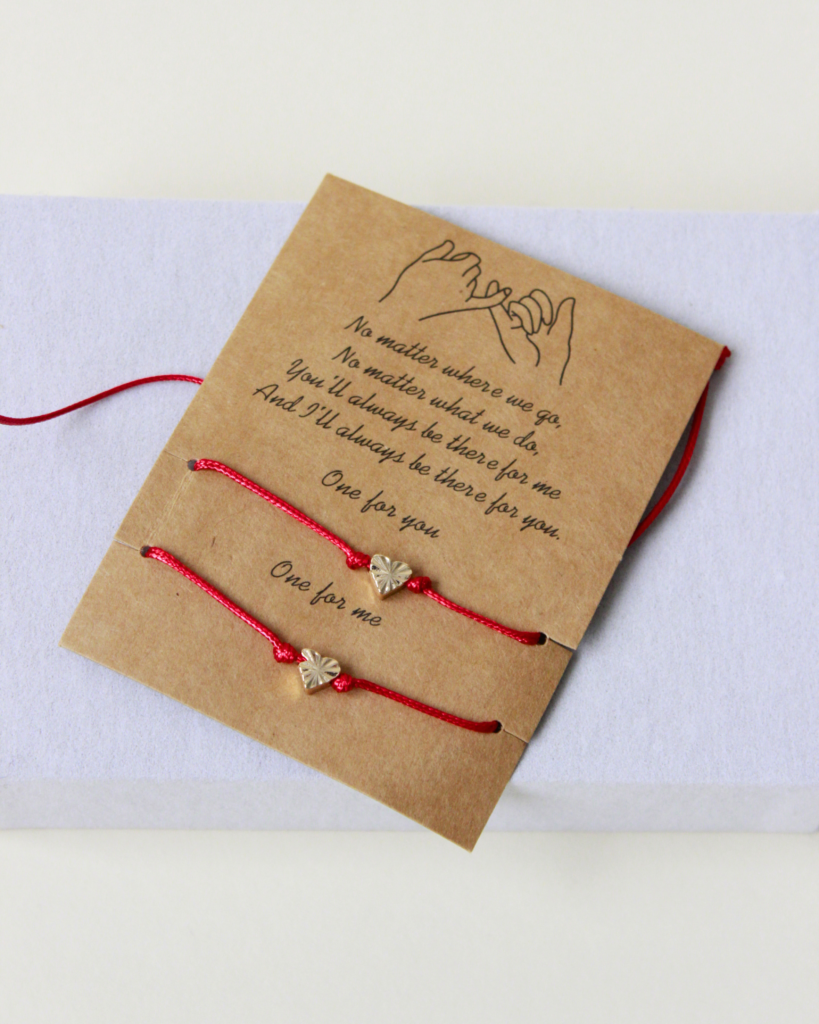 red string thread bracelet with heart