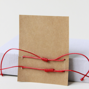 red string bracelet back