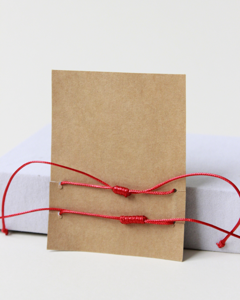 red string bracelet back